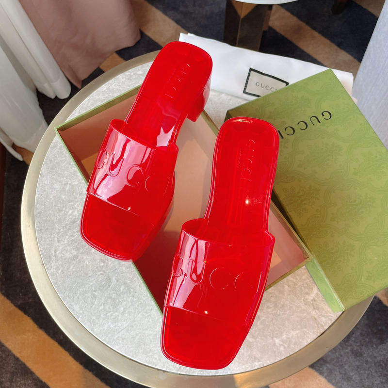 G*u*i plastique logo-embossed rubber mules